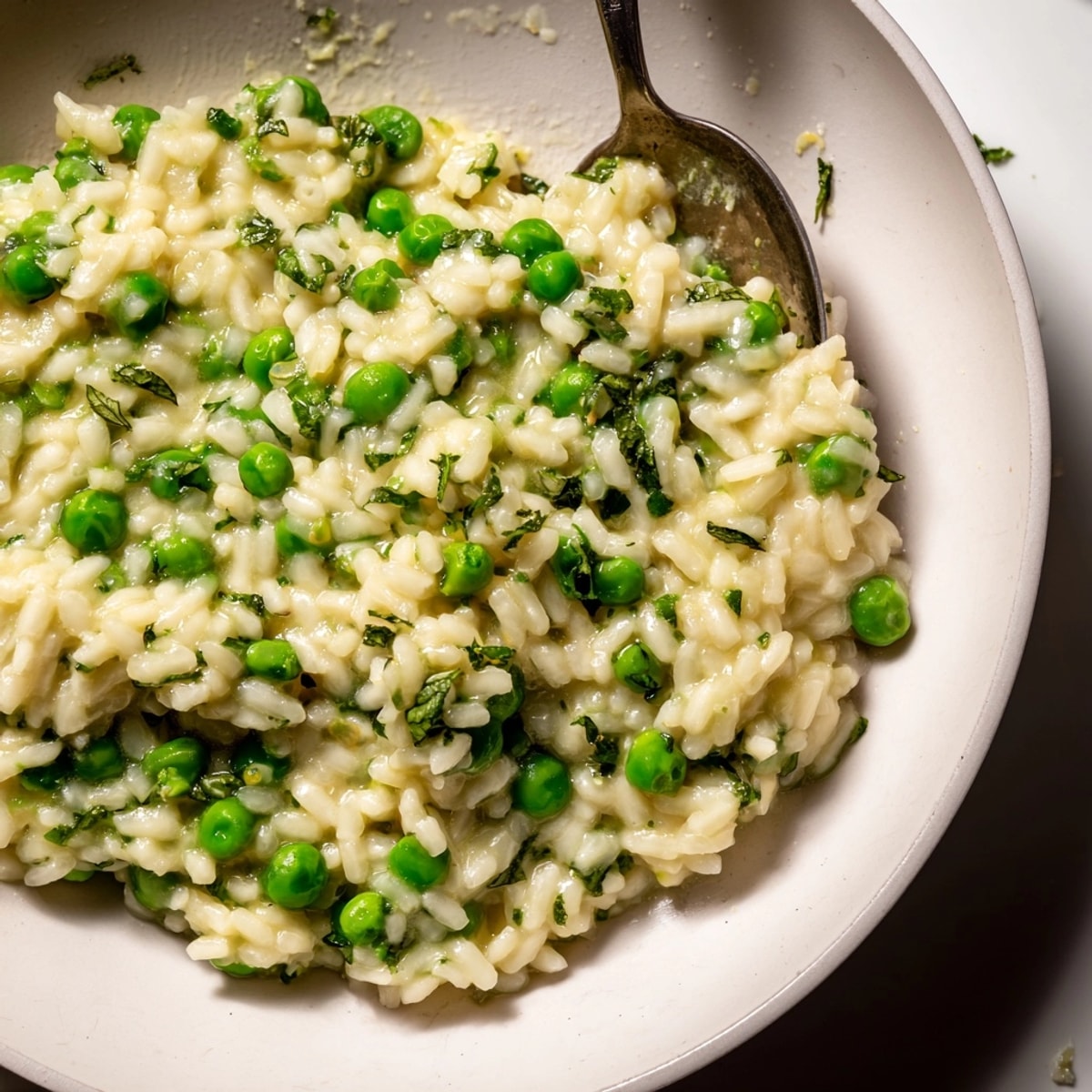 Creamy Spring Pea Risotto with bright green peas, lemon, and fresh herbs, ready to savor.