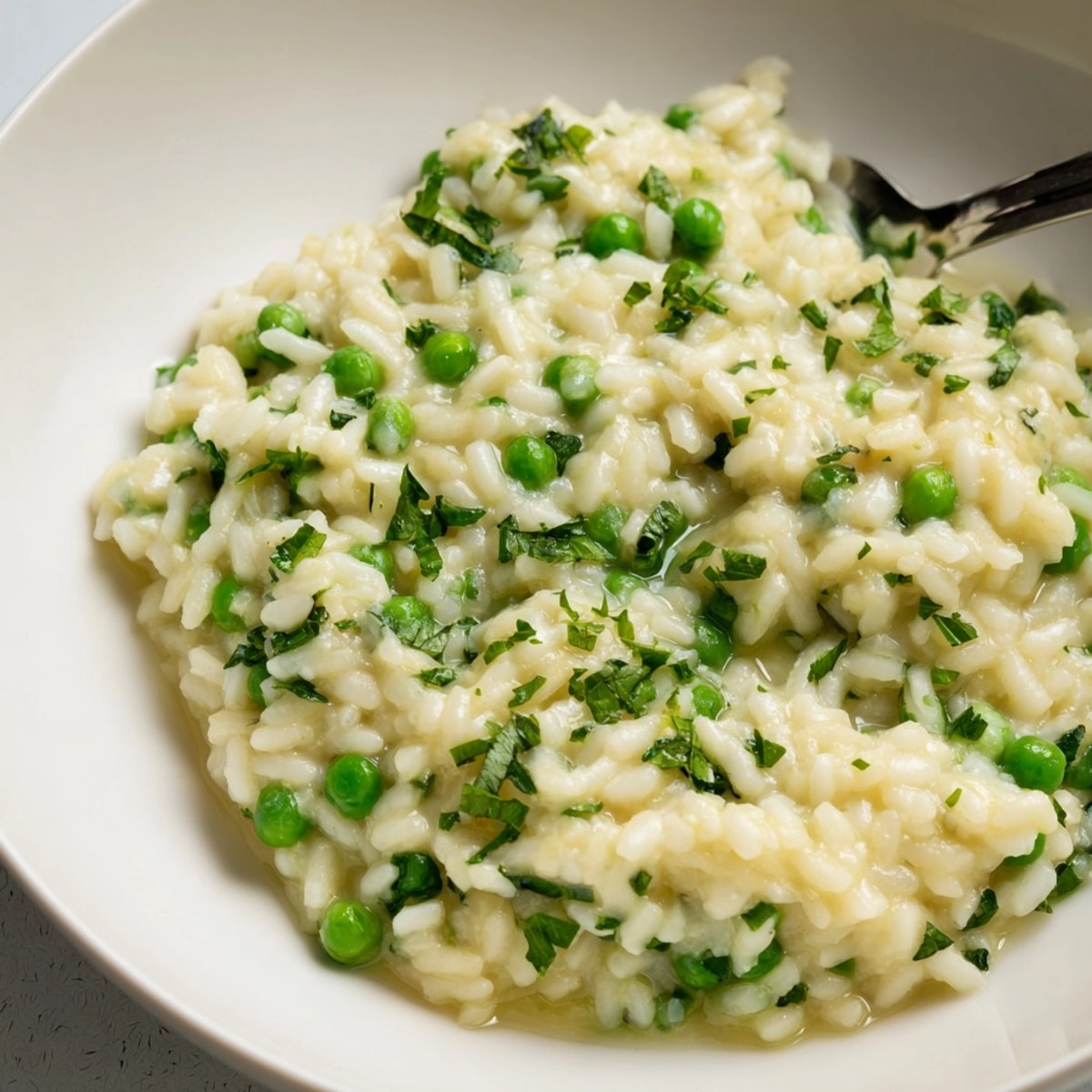 Homemade Spring Pea Risotto recipe: Savor vibrant green peas and lemon zest in creamy rice.