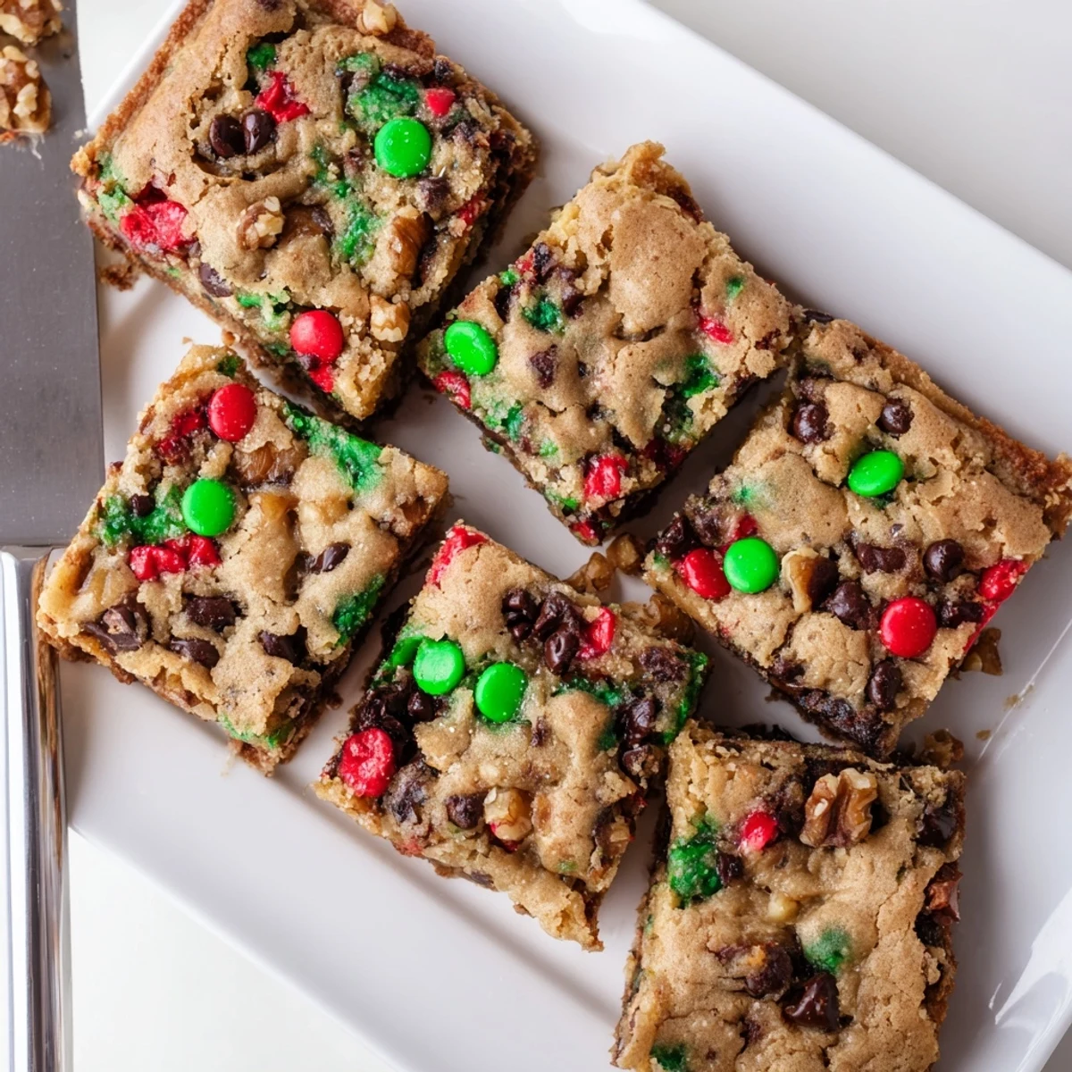 Soft festive Christmas cookie chocolate chip bars with sprinkles, perfect for holiday gatherings.  