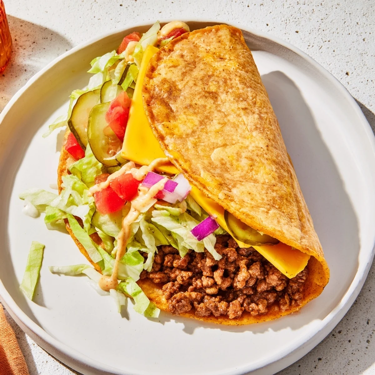 Golden-brown Viral Cheeseburger Tacos filled with seasoned beef, cheese, and fresh toppings, ready to enjoy.