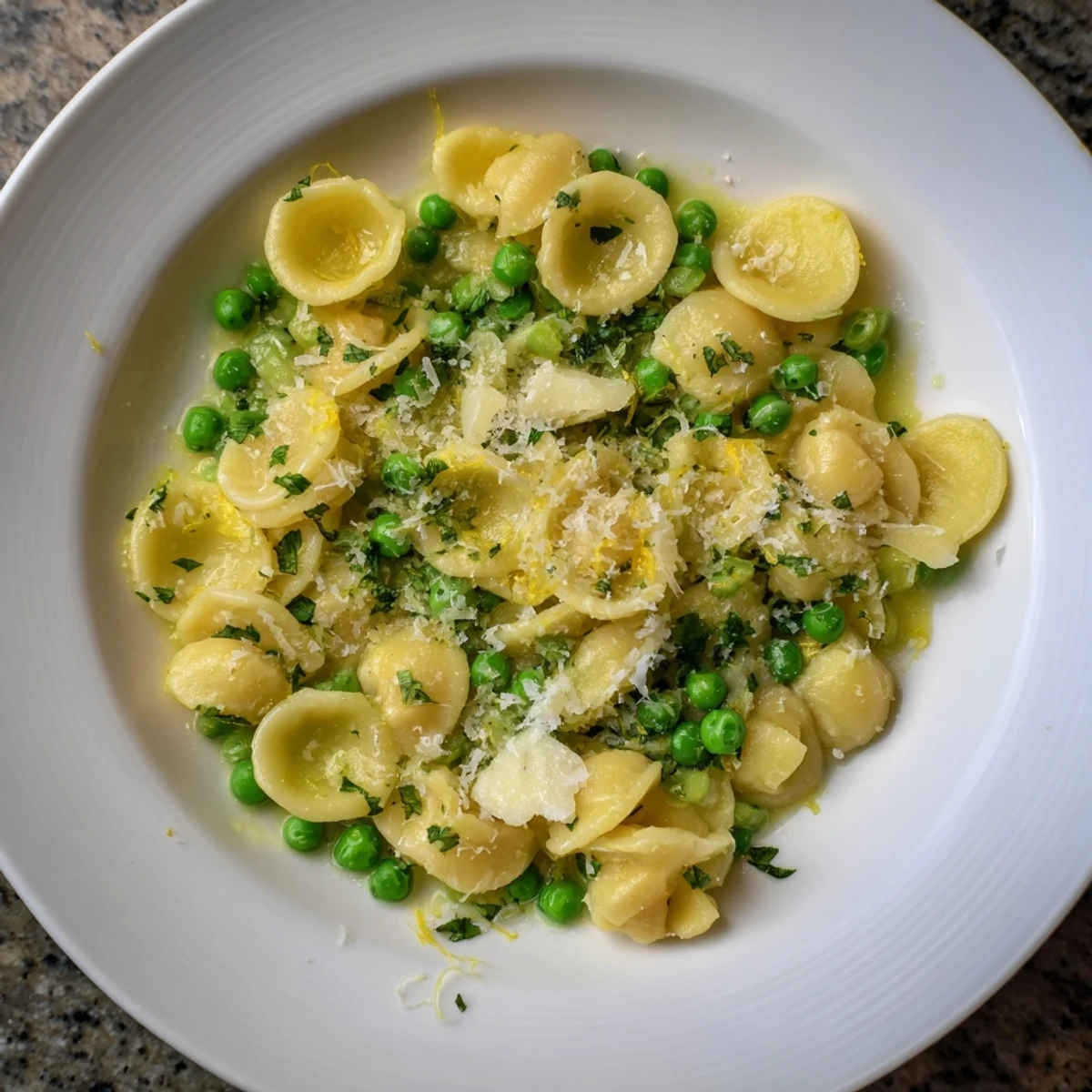 Close-up of Garlic Butter Ditalini with Peas, showcasing the creamy sauce and bright green peas.