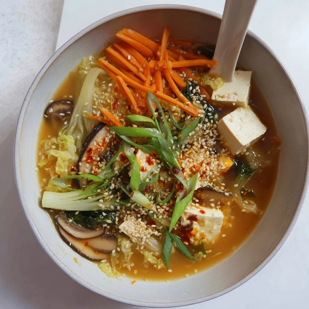 Hearty Ginger-Miso Winter Soup with silken tofu and napa cabbage, offering a comforting, umami-rich meal for cold days.