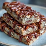 Rich, chewy protein bars that taste like classic cookie dough, featuring vanilla protein powder and almond butter for a post-workout treat.  