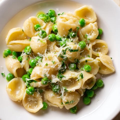 Steaming Garlic Butter Ditalini with Peas, a delicious Italian-inspired pasta dish perfect for dinner.