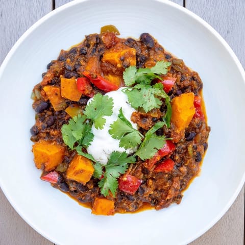 A colorful close-up of the flavorful Sweet Potato & Black Bean Chili, ready to be enjoyed.