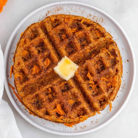 A stack of delicious sweet potato waffles, steaming hot and wonderfully aromatic for breakfast.