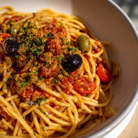 Close-up of freshly made Puttanesca Ditalini, a flavorful Italian pasta dish ready to eat.