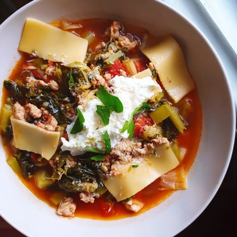 Vibrant image of a rich Healthy Lasagna Soup Christmas Pasta Bowl, perfect for a cozy holiday dinner.
