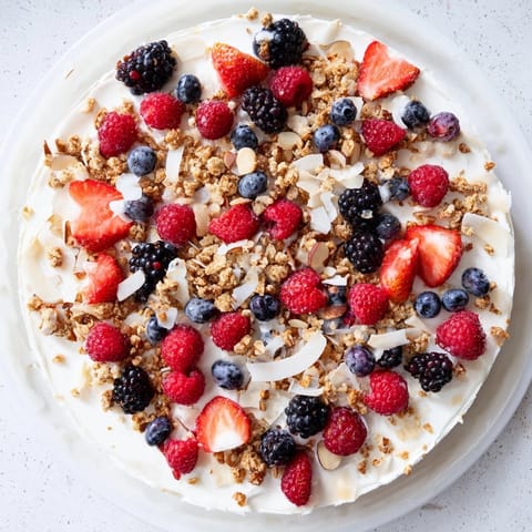 Vibrant photo of Berry Yogurt Bark with juicy berries, swirled yogurt and crunchy granola.