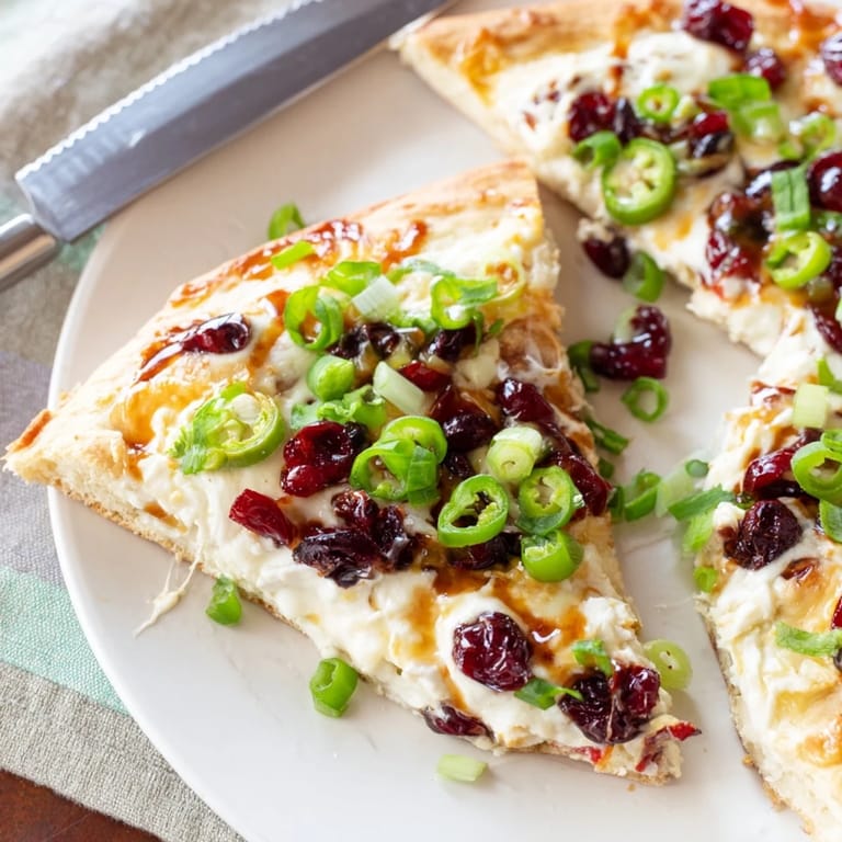 Vibrant Cranberry Jalapeño Dip Pizza with a crispy crust and zesty flavors.